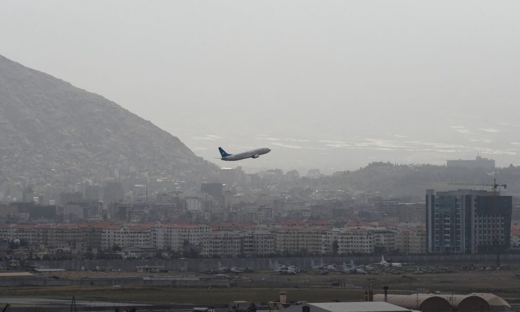 An aircraft takes from the airport in Kabul as the Taliban closes in on the city