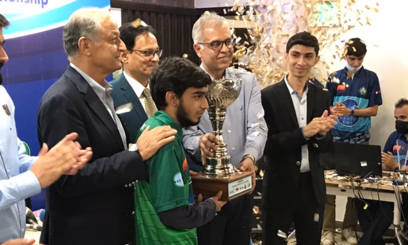 Scrabble champion Syed Imaad Ali collecting his trophy after winning the WESPA World Youth Scrabble Championship